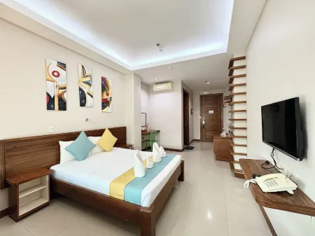 Sunburn Suites Coron Отели рядом с достопримечательностью «Coron Plaza Fountain»