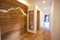 Modern chalet with a wraparound balcony with majestic views of the mountains