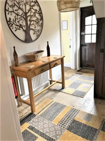 Fairlie Cottage Overlooks the River in Bourton-on-the-Water parking for 3 cars.