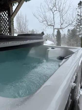 The Governor's Suite - An executive oasis featuring a hot tub, fire pit and BBQ!