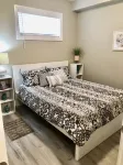 Cozy 2 bedroom basement with 2 beds, kitchen, 75’’ TV and bathroom