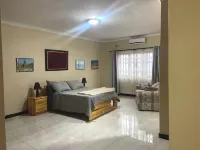 Spacious and staffed 4-bedroom house with WiFi and AC in Blantyre