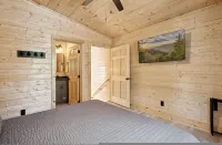 Green & Black Bear Cabins by Beyond Expectations