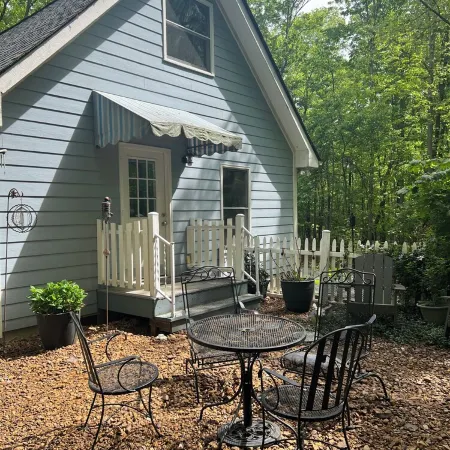The Blue Cottage located in the woods on Lookout Mountain in Rising Fawn GA