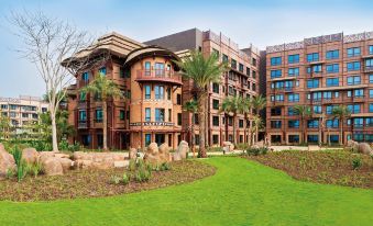 "A large building with trees in front has the words ""I love my life"" written on it" at Disney Explorers Lodge