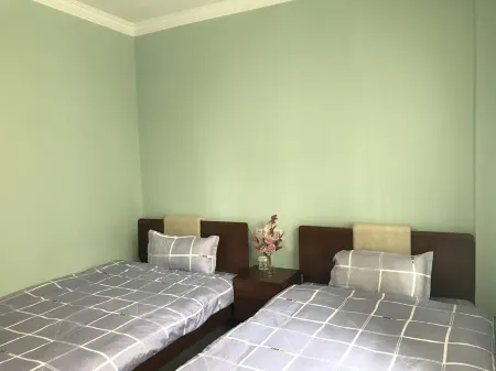 Yimiyangguang YY Apartment (Huota Line) Отели рядом с достопримечательностью «Mulan Grassland»