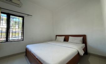 OYO 94244 Ezhar Boka Homestay Near Gor Sulis Bulutangkis