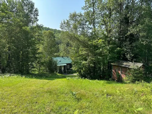 Rural Vermont with internet and Smart TV, cell phone works,  Dogs welcome.