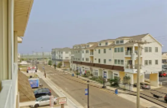 Bright and Airy Condo.  One block to the Beach.  Great location.