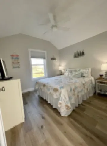 Cozy riverfront cottage with an easy beach-inspired coastal MI vibe!