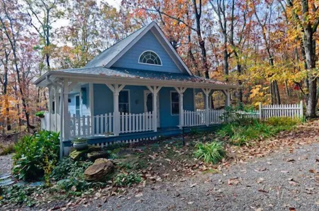 The Blue Cottage located in the woods on Lookout Mountain in Rising Fawn GA