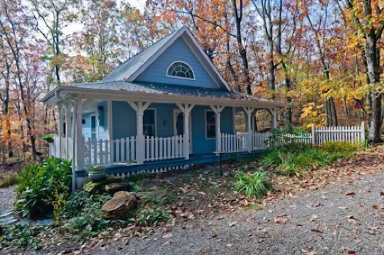 The Blue Cottage located in the woods on Lookout Mountain in Rising Fawn GA