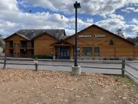 Cozi retreat set in the woods within walking distance of Waubee Lake.