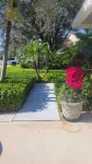 Golf cart distance to WEF! Charming 3 bedroom waterfront home with heated pool.