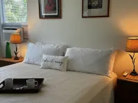 Tropical Gardens and Serene Community Amenities - Charming Island Retreat