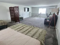 Fire Pit and Outdoor Games Await - Charming Family Retreat Hotels in Alpena