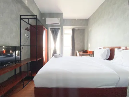 Homey and Good Choice Studio at Amartha View Apartment Отели в г. Ngaliyan