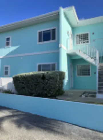 The Harvey Nicole: Modern Caribbean Ocean Front Condo Grand Cayman.