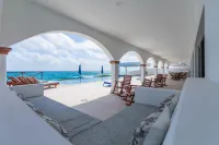 Brand New 12 Suite Villa  directly on the waters edge of the Caribbean Sea
