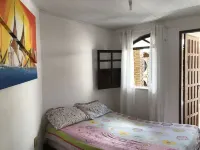 Cozy and charming house with pool and gardens in sea front condominium!