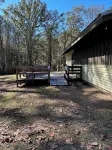 3-bedroom cabin nestled on 80 acres with WiFi, AC on private 5-acre lake.