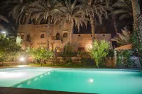 Beautiful Kasbah in the Middle of an Oasis and a Calm and Peaceful Palm Grove