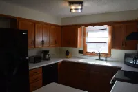 Spacious house with large yard in great location close to boat ramps.