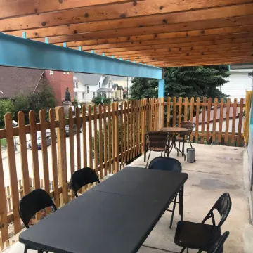 Covered parking/3 bedrooms, sitting room, restroom w/laundry, full kitchen, deck