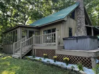 Cabin with hot tub, fire pit, and fishing pond.