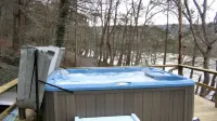Siesta River Cabin,  Riverfront, fabulous views G.W. Forest, hottub, fireplace