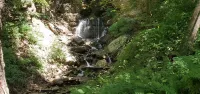 Camper next to a waterfall!