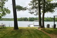 NEW! Renovated Bungalow steps from Lake Tomahawk - King Bed, Dock Space, Firepit