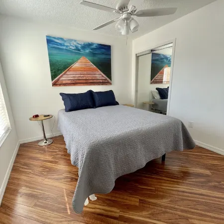 Courtyard Villa with gas golf cart located between two Town Squares!