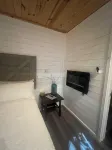 Secluded creekside treehouse cabin in Shelby with hot tub, AC, WiFi