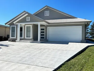 The Ocean’s Edge is a contemporary coastal home with stunning beach views.