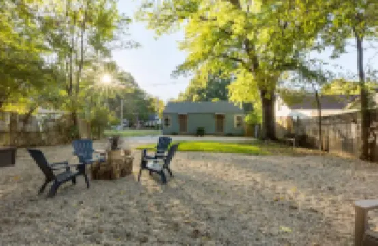 Relaxing Backyard and Cozy Seating Area - Charming Urban Haven