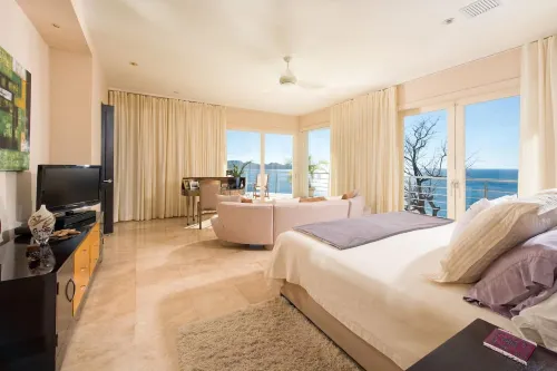 Exquisite Hilltop Villa with Luxurious Modern Design, Sweeping Ocean Views & Sparkling Infinity Pool - Private Pools