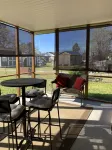 Updated bungalow with screened in porch  in rear.