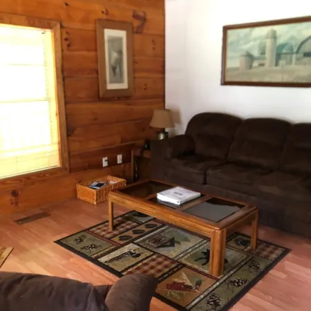 Cozy Cabin in the Woods in a Relaxing Area with Wrap Around Porch Rocking Chairs