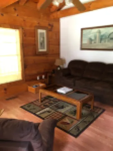 Cozy Cabin in the Woods in a Relaxing Area with Wrap Around Porch Rocking Chairs