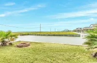 Spacious deck 5-bedroom home in Freeport with WiFi, 3 full baths sits on canal.
