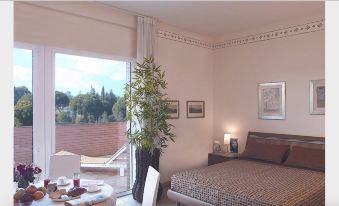 Spacious Apartment Long Stay Rome Area I Triangoli with Garden in the Backyard