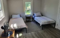 Charming Riverhead home with large outdoor patio & backyard  firepit