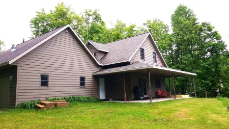 Beautiful newer home on the sunny side of peaceful Camp Lake in Iron River