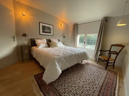 Provencal farmhouse on a hillside surrounded by centuries-old olive and oak trees