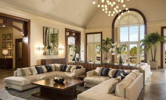 The grand hotel in Kuala Lumpur offers a living room furnished with couches and tables at Hyatt Ziva Rose Hall
