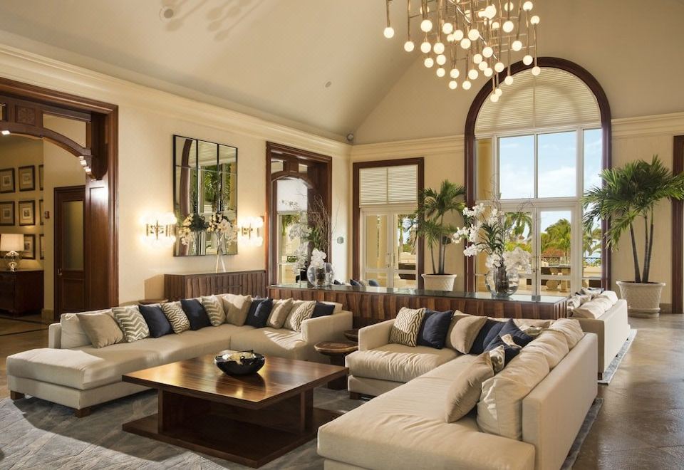 The grand hotel in Kuala Lumpur offers a living room furnished with couches and tables at The Ritz-Carlton Golf & Spa Resort, Rose Hall, Jamaica