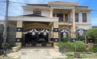 OYO 93502 Homestay Pakmuklis Syariah 2