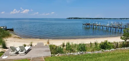 The Beach Retreat is a cozy beach Villa with Hottub overlooking a private beach.