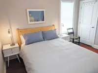 Enjoy sea breezes from double-decker porch -  walk to pool, private waterfront.